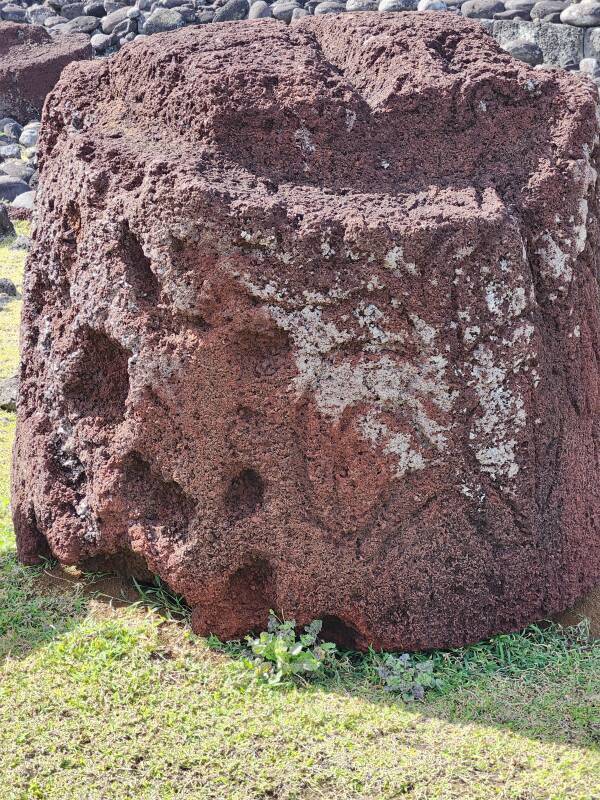 Red scoria with petroglyphs.