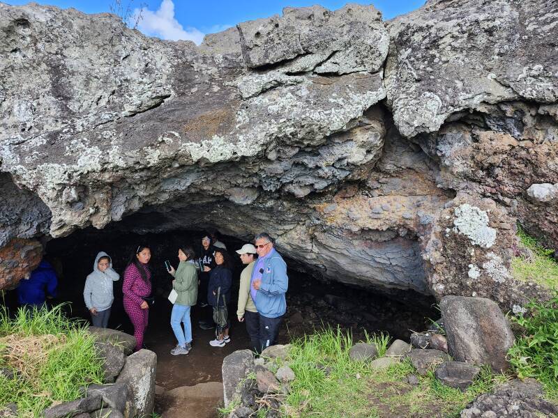 Either people standing in a lava cave.