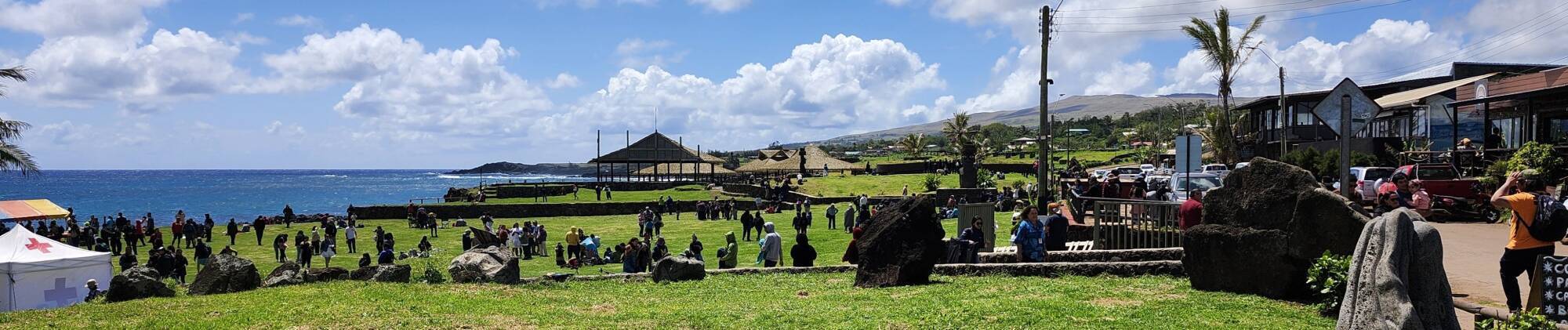 People in the park along the waterfront in Rapa Nui during the annular solar eclipse on 2 October 2024.