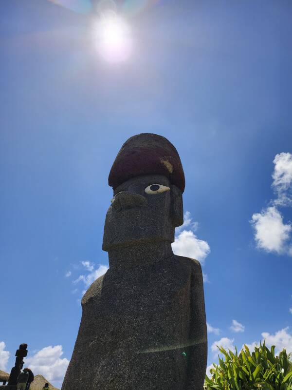 Partial phase of annular solar eclipse with mo'ai in foreground, seen in Hanga Roa, Rapa Nui.