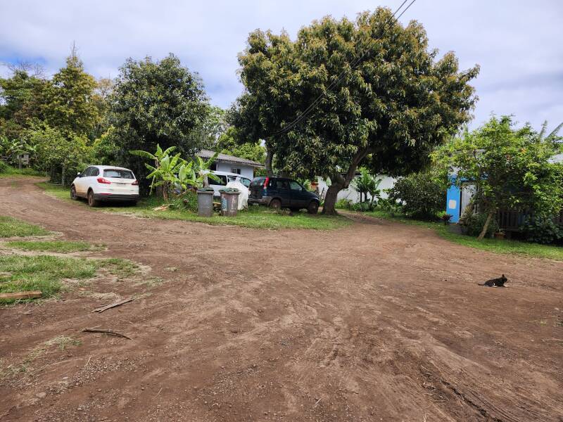 Cars and other dwellings around Hostal Henua Roa.