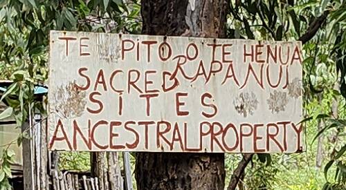 Sign reading: Te Pito Te Henua / Rapa Nui / Sacred Sites / Ancestral Property.