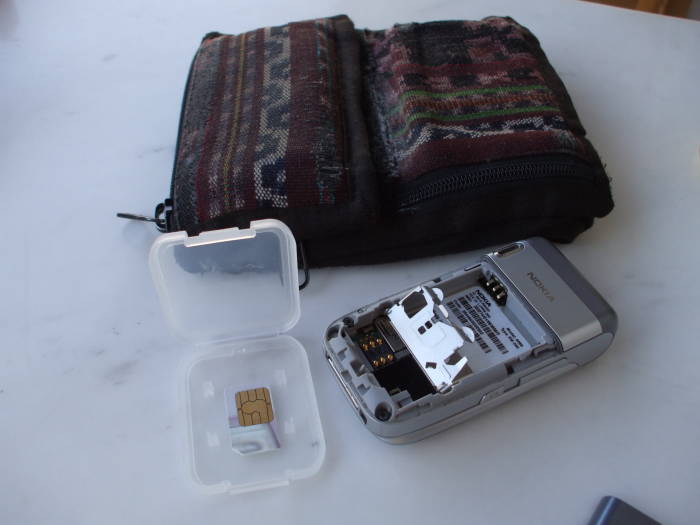 Storing the SIM card in a plastic carrier originally used for a digital camera flash chip.