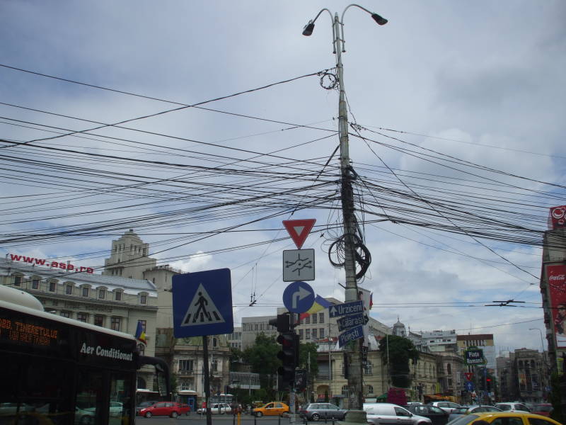 Many telephone and other telecommunication lines in Bucharest, Romania.