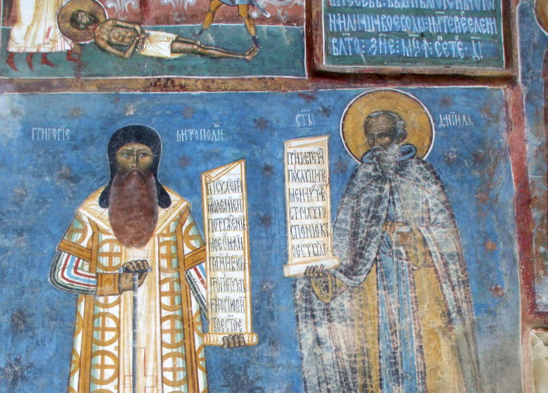 Detail of frescoes at Voroneţ Monastery in Bucovina, near Gura Humorului in northeastern Romania.  Romanian Metropolitan Grigoriy and a saint, Cyrillic Romanian scrolls.