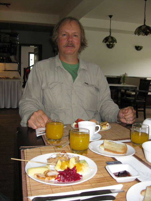 Bob eating Romanian breakfast in Gura Humorului.