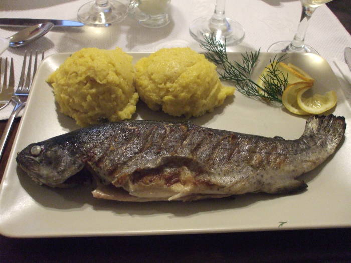Romanian dinner in Gura Humorului with grilled fish and mămăligă.