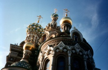 Colorful gilded and tiled domes and Orthodox crosses on the Church of the Spilled Blood in Sankt-Peterburg, former Leningrad, Russia.