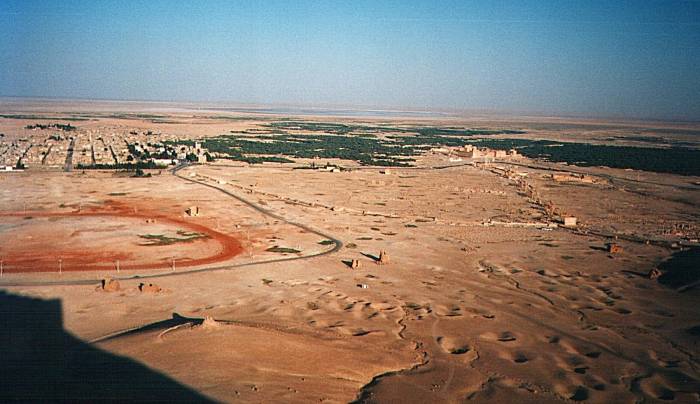 The modern town of Tadmur and the ruins of Palmyra, seen from the hilltop fortress.