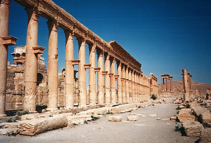 The Decumanus, a colonnaded street extending from the Temple of Ba'al through the Palmyra (Tadmur) city center.  The Tetrapylon is just beyond the colonnade.