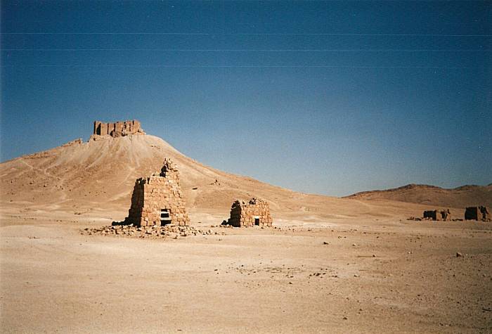 Crumbling funerary towers in The Valley of the Tombs at Palmyra, Syria.