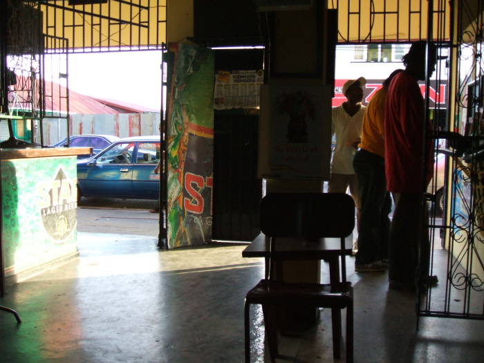 Hanging out with the locals at Bar 52 in western Port of Spain, Trinidad.  Looking out the door as the traffic passes.