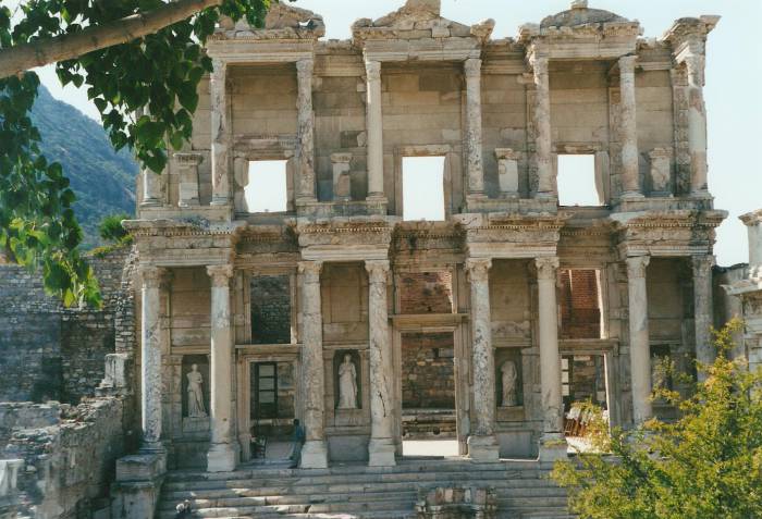 Ephesus: the Library of Celsus.  An ornate facade of marble with an array of columns and porticos on two levels.