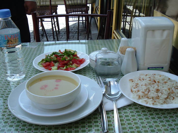 Turkish meal of lentil soup, plav, and salad.