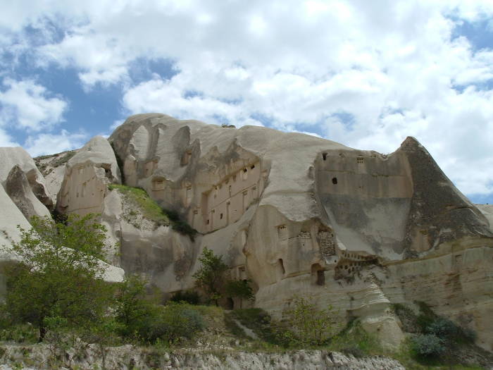 Monastic center carved into tuff cliffs in Cappadocia, Turkey.