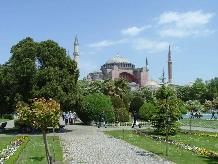 Exterior of the Hagia Sophia or Aya Sofya, in Istanbul.  Four large minarets around a large dome.