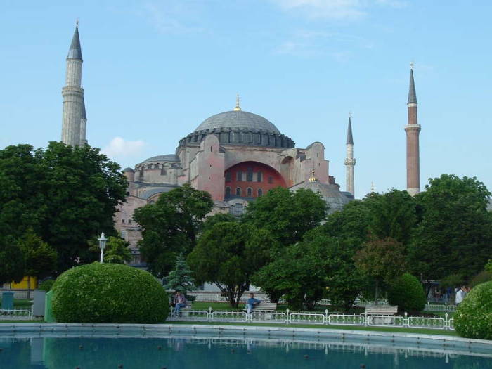 Exterior of the Hagia Sophia or Aya Sofya, in Istanbul.  Four large minarets around a large dome.