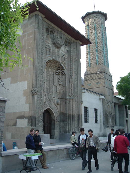 Ince Minare Medresesi, or the Seminary of the Slender Minaret, with elaborate carving on the gateway and blue-green tile work on the minaret.  Central Asian style Seljuk architecture in Konya.
