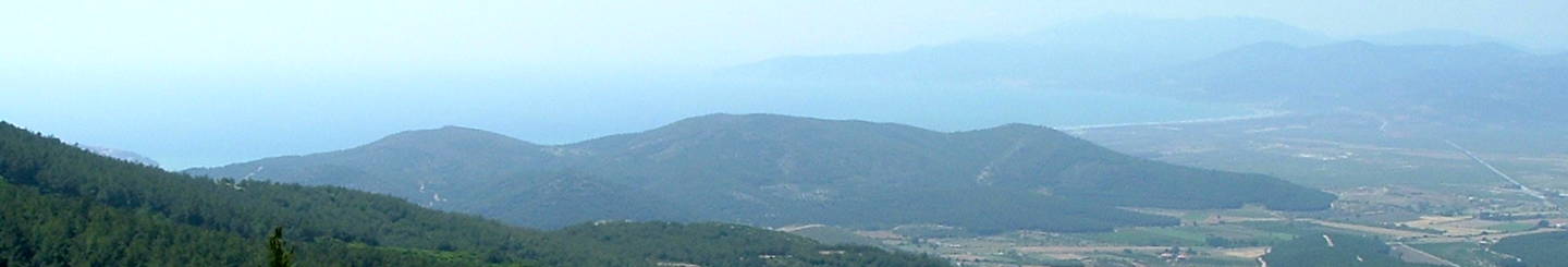 View from the walk up the mountain to the Virgin Mary's house at Maryemana Evi, near Ephesus.  Forest and mountains in the foreground, the Aegeaen coast in the distance.