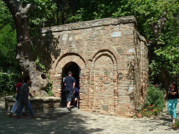 Visitors entering the Virgin Mary's house at Maryemana Evi.