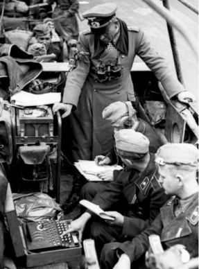 General Heinz Guderian in the Battle of France with a communications team using an Enigma machine, from https://en.wikipedia.org/wiki/File:Bundesarchiv_Bild_101I-769-0229-10A,_Frankreich,_Guderian,_%22Enigma%22_cropped.jpg