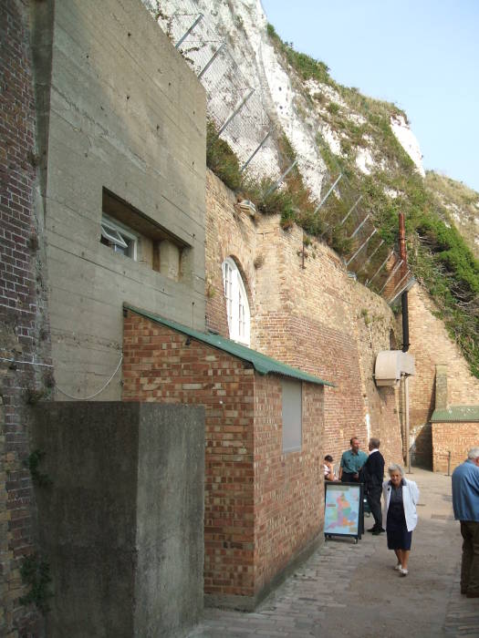 Tunnels enter the cliff face.