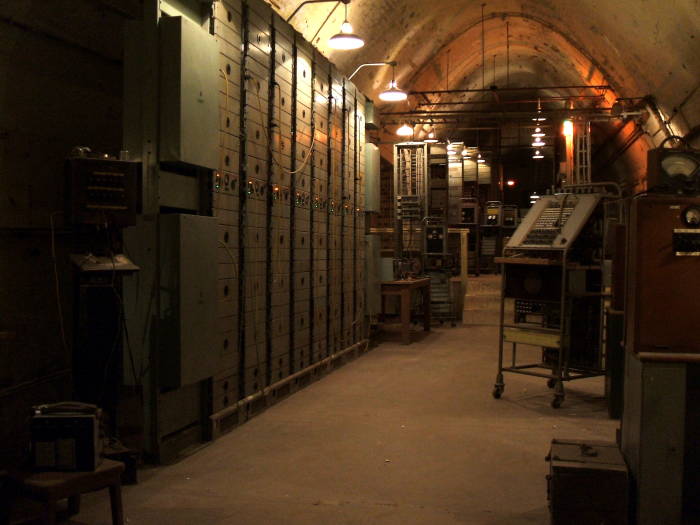 Large racks of signal repeating equipment, and some electronic test equipment.