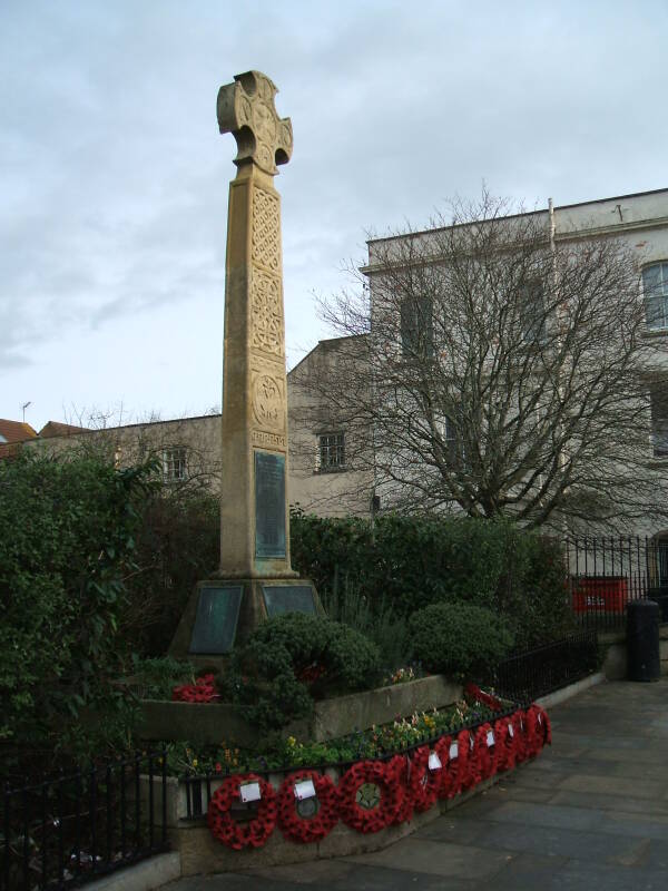 Celtic cross on a World War One memorial at Saint John's Church along the High Street in Glastonbury, plaque for World War Two added later.