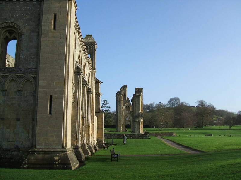 South exterior of Glastonbury Abbey and the Tor in the distance.