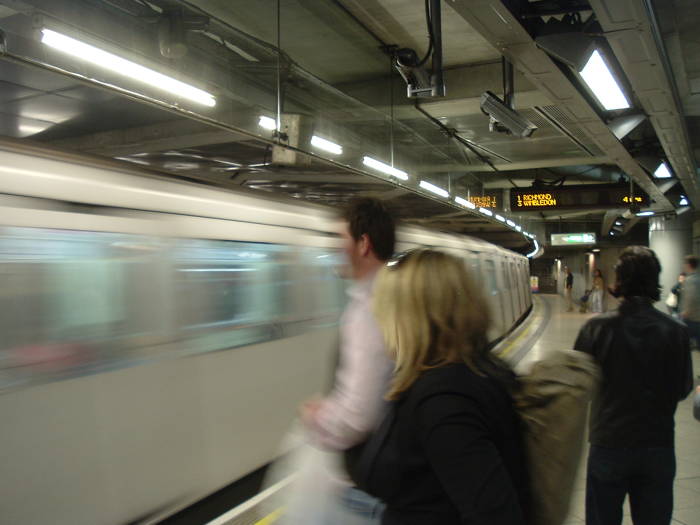 London Underground train pulls into the Tube station.