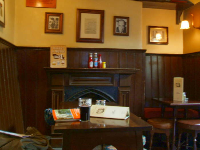 The Eagle and Child pub, Oxford, where C.S. Lewis and J.R.R. Tolkien met with the 'Inklings' literary group.  Interior of the pub, where the Inklings met next to the fireplace in the Rabbit Room.