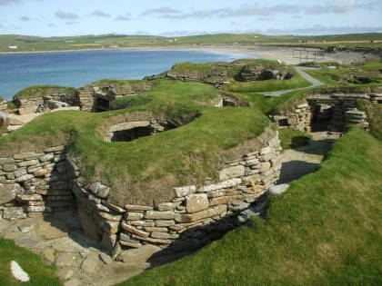 Neolithic dwellings exposed on the beach at Skara Brae in Orkney.