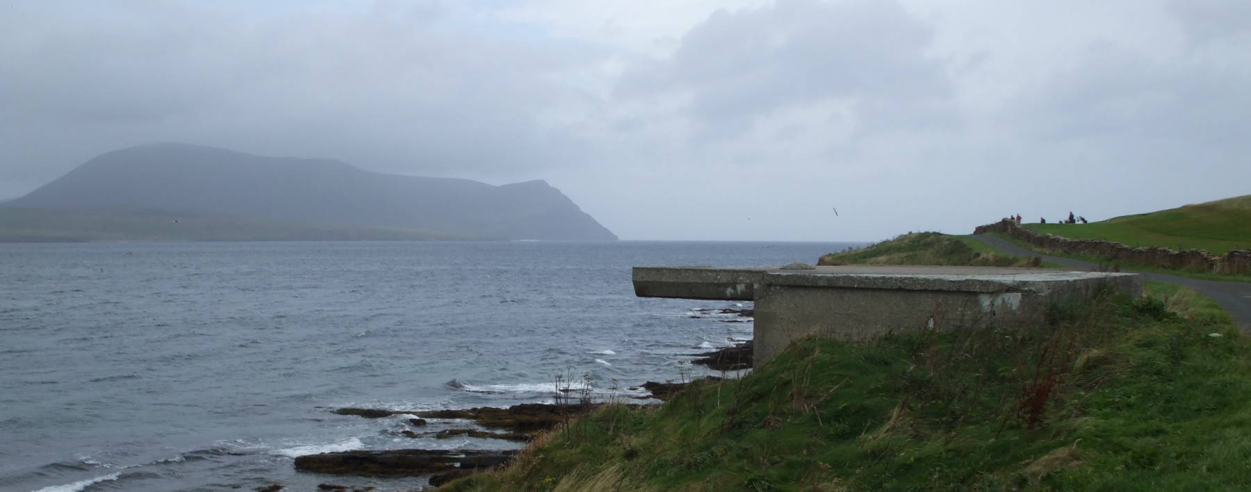 World War II defensive bunker on Mainland, Orkney, with Hoy visible across Hoy Sound.