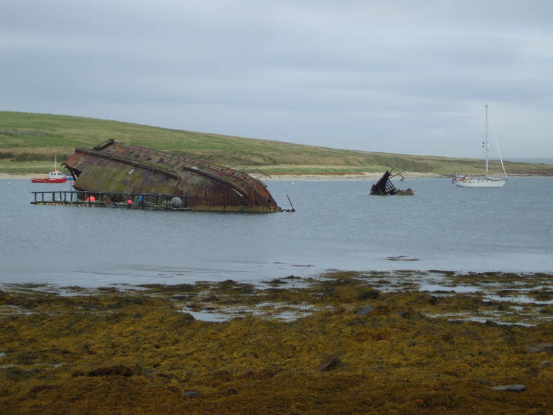 Old blockships beside Churchill Barrier #3 crossing Weddell Sound to Glimps Holm.