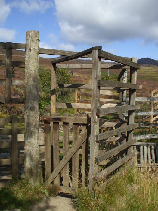 Trekking through the Scottish Highlands:  Gate along a mountain walk near Pitlochry, Scotland.