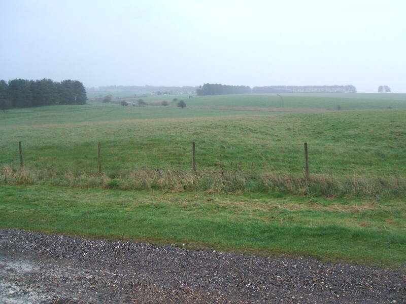 Crossing the Cursus while hiking along the cross-country path to Stonehenge.  Woodhenge is in the distance beyond the trees.