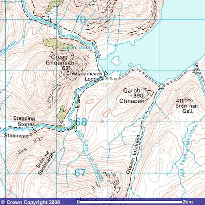 Trekking through the Scottish Highlands along Loch Trèig, north of Rannoch Moor in Lochaber, in the Scottish Highlands.