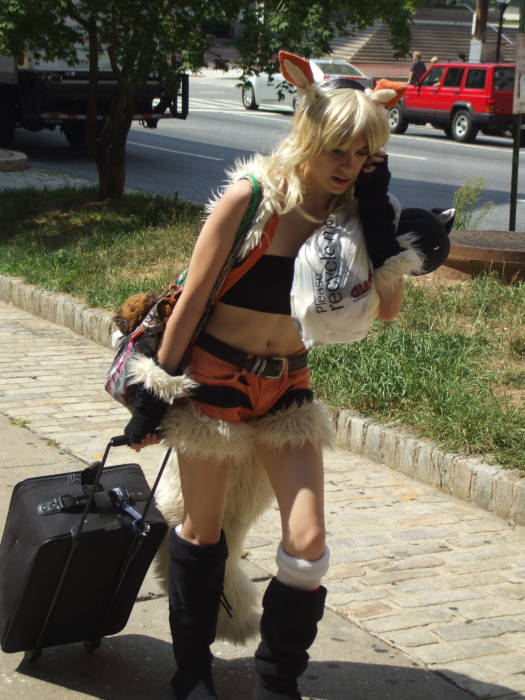 Orange fox girl cosplay at Otakon anime and manga conference in Baltimore.