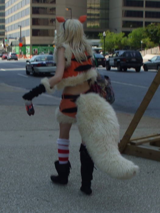Orange fox girl cosplay at Otakon anime and manga conference in Baltimore.