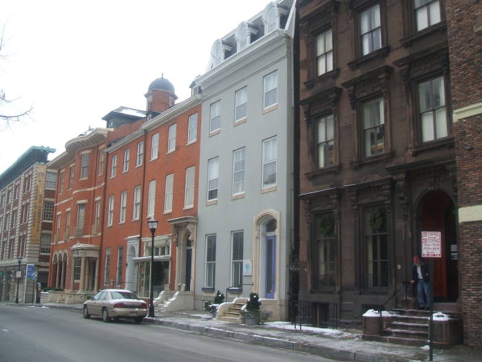 HI-Baltimore hostel at right in an old brick mansion.  Two buildings to the left is the Latrobe House, where Poe's 'MS. Found In A Bottle' was awarded a fifty dollar prize.