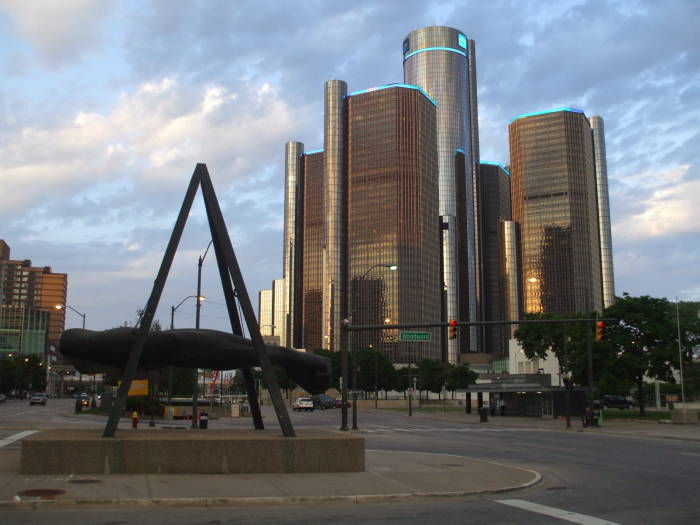 Detroit Renaissance Center with statue of Joe Lewis' arm.