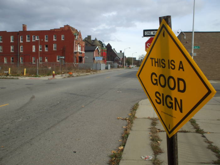 A sign saying 'This is a Good Sign' along Temple Street east of Cass Street near the Masonic Temple in Detroit.