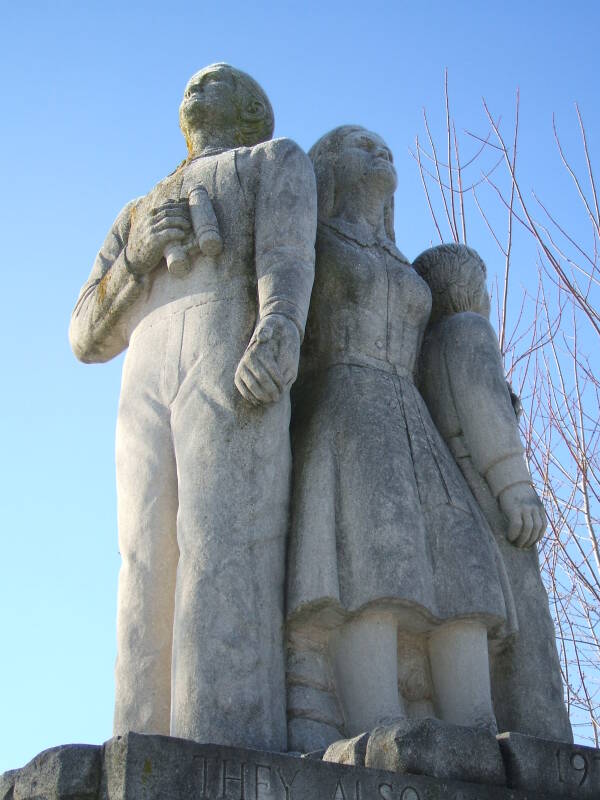 Limestone statue of three family members watching for Soviet bombers at the Cairo Cold War watchtower in northern Tippecanoe County, Indiana.