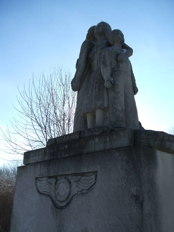 Limestone statue of three family members watching for Soviet bombers at the Cairo Cold War watchtower in northern Tippecanoe County, Indiana.