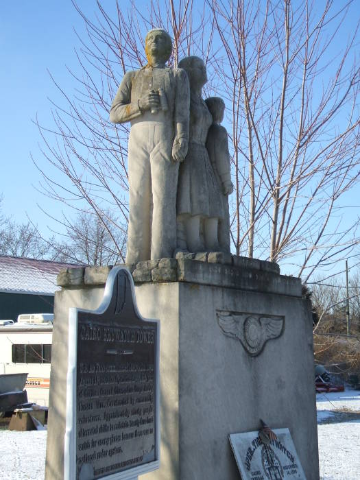 Limestone statue of three family members watching for Soviet bombers at the Cairo Cold War watchtower in northern Tippecanoe County, Indiana.