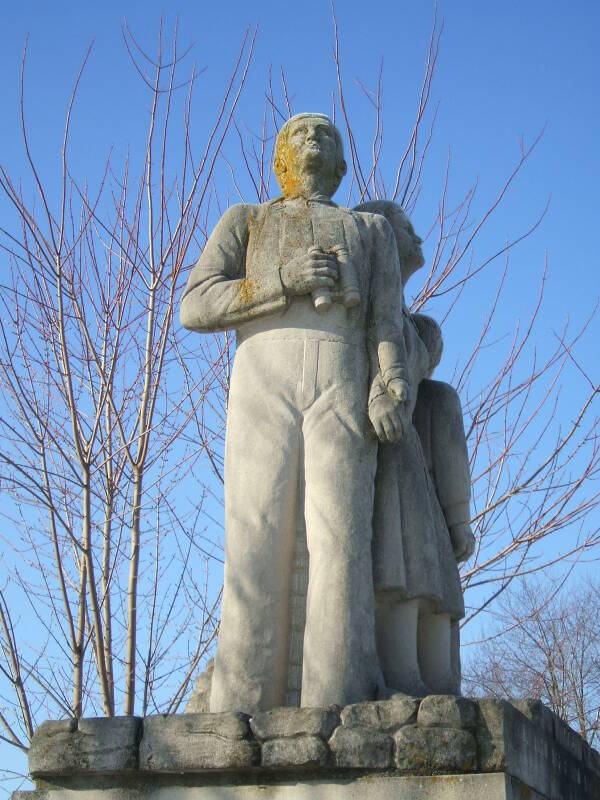 Limestone statue of three family members watching for Soviet bombers at the Cairo Cold War watchtower in northern Tippecanoe County, Indiana.