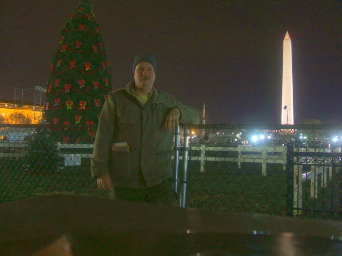 U.S. National Christmas Tree behind chain-link fence.
