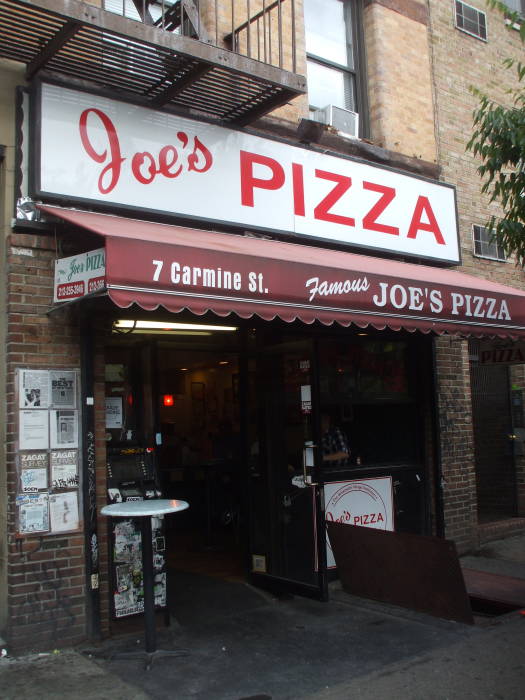 Joe's Pizza at 7 Carmine Street, just north of Bleecker Street and Sixth Avenue in Greenwich Village, Manhattan, New York.