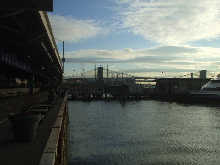 View north over Pier 11, the Gouverneur Lane ferry terminal and the South Street Seaport to the Brooklyn Bridge and Manhattan Bridge.