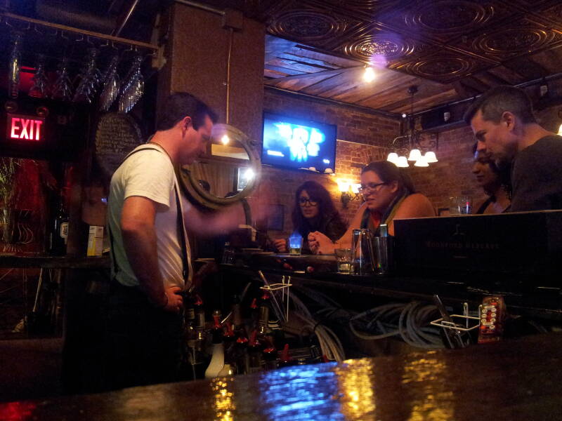 Bartender flaming absinthe in the Lovecraft Bar on the Lower East Side of Manhattan, 50 Avenue B.